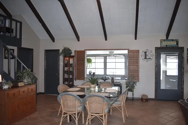 a view of a chairs and table in the patio