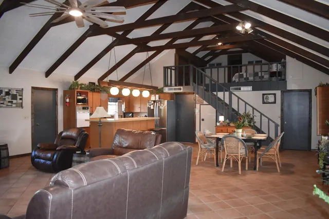 a view of a dining room with furniture and window