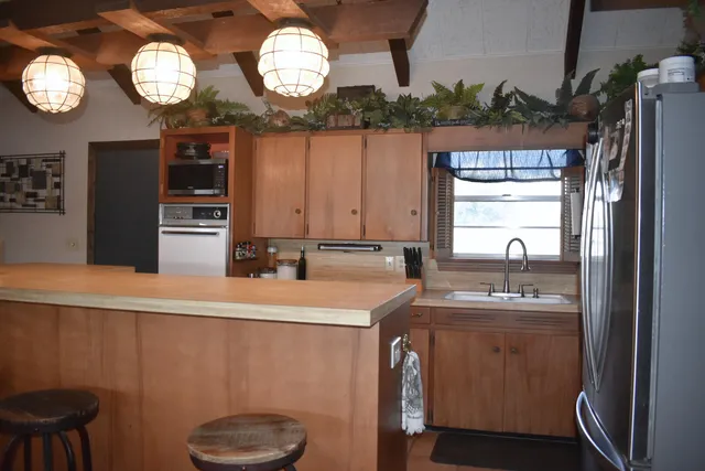 a bedroom with a bed and a cabinet