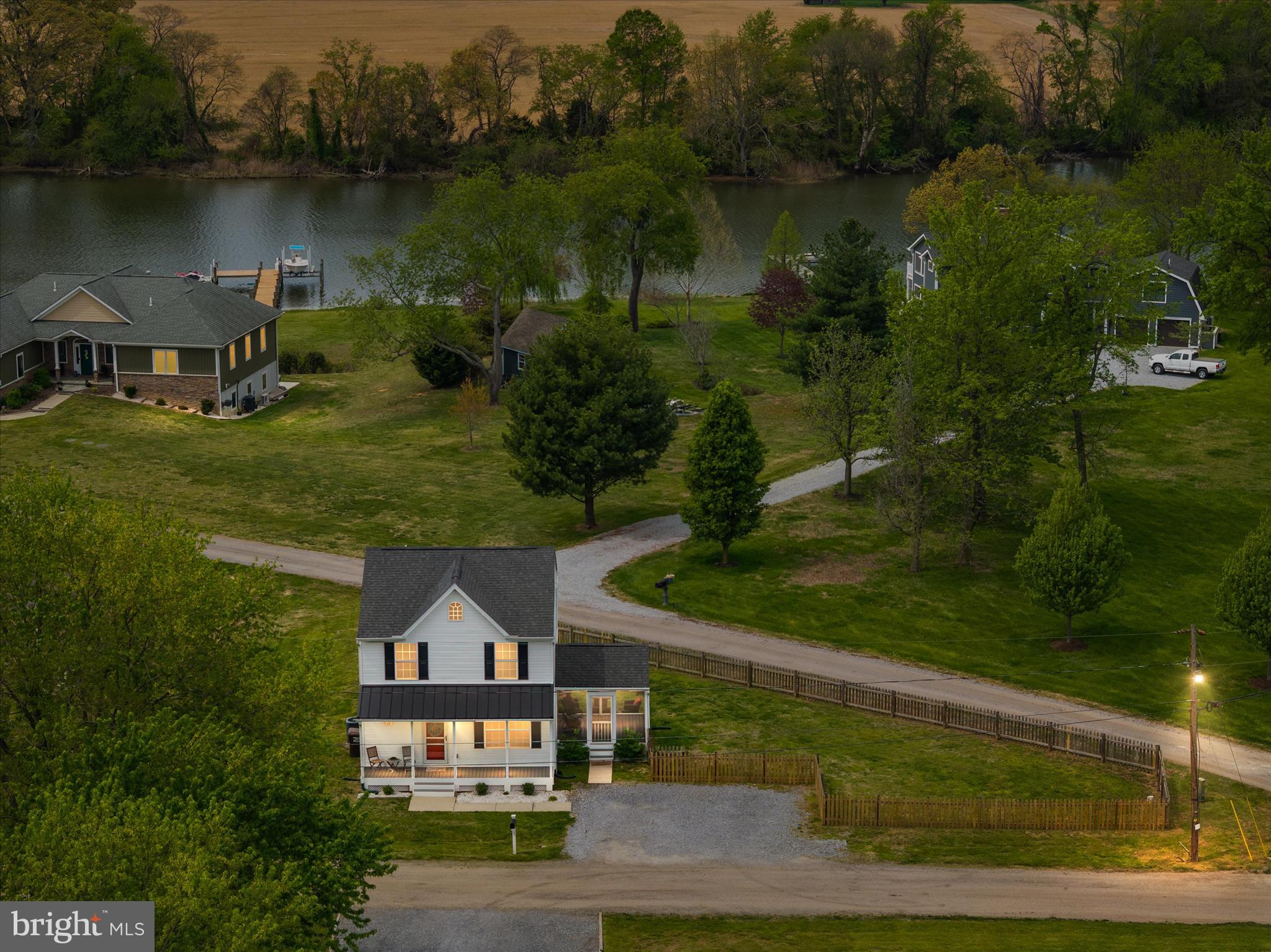200 Newtown Road Chester, MD 21619 - Photo 2 of 50 an aerial view of a house with garden space and a lake view