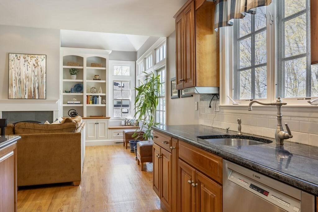 7 Pierrepont Road Winchester, MA 01890 - Photo 16 of 38 a kitchen with stainless steel appliances granite countertop a sink a stove and a wooden floors