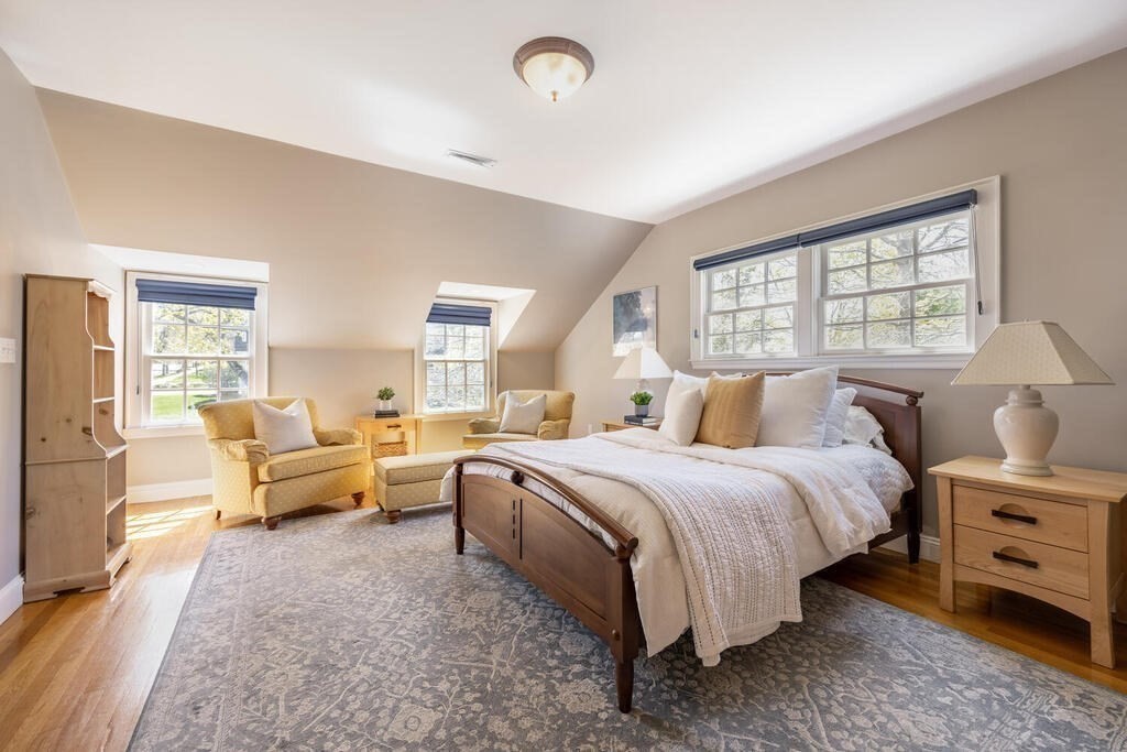 7 Pierrepont Road Winchester, MA 01890 - Photo 23 of 38 a spacious bedroom with a bed and a couch