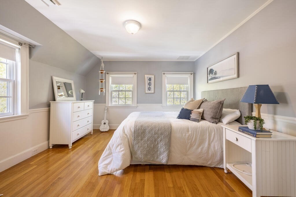 7 Pierrepont Road Winchester, MA 01890 - Photo 27 of 38 a spacious bedroom with a bed and wooden floor