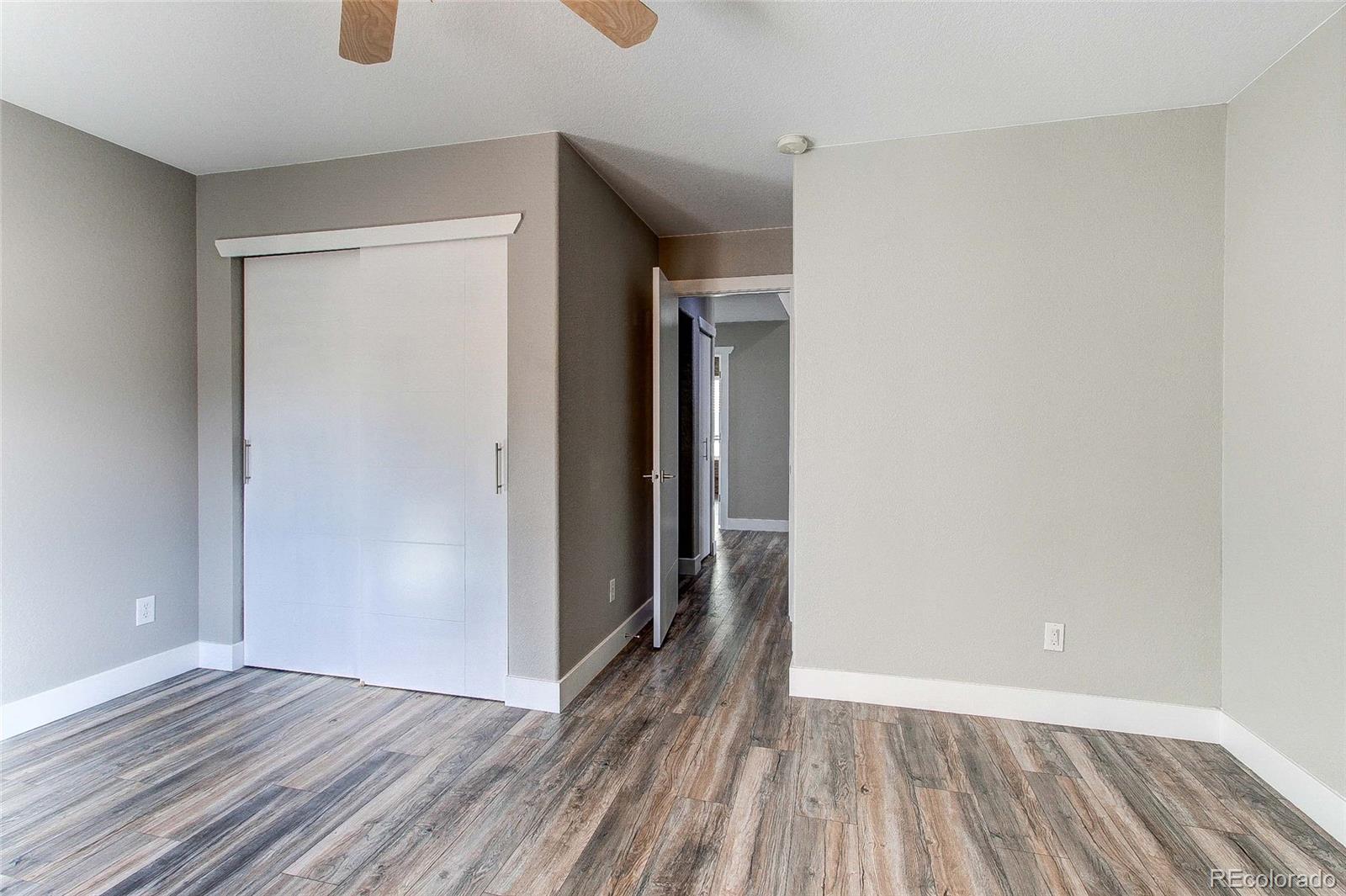 16082 Butterwort Circle Parker, CO 80134 - Photo 11 of 39 a view of hallway with wooden floor