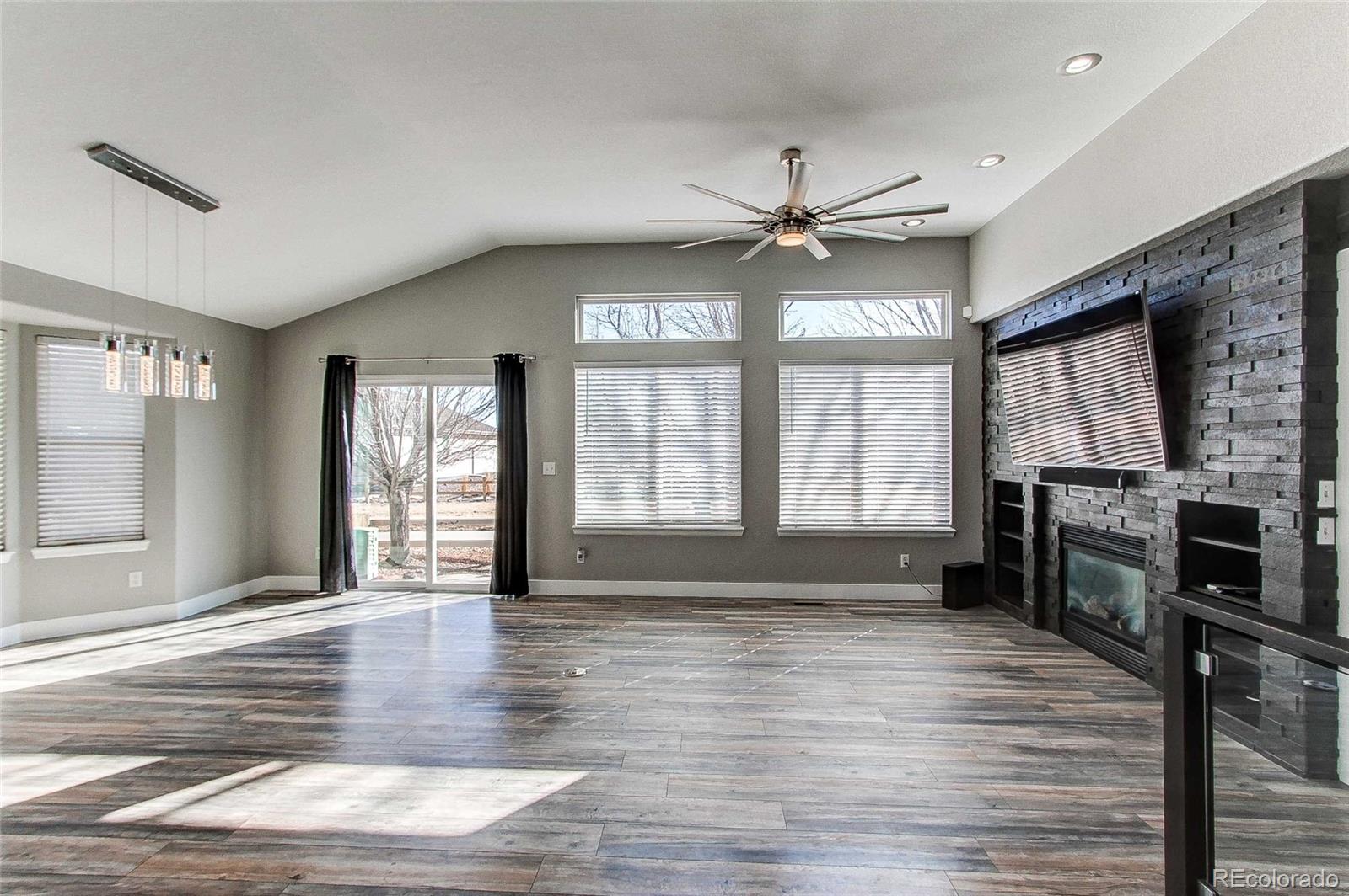 16082 Butterwort Circle Parker, CO 80134 - Photo 18 of 39 a view of an empty room with wooden floor and a window