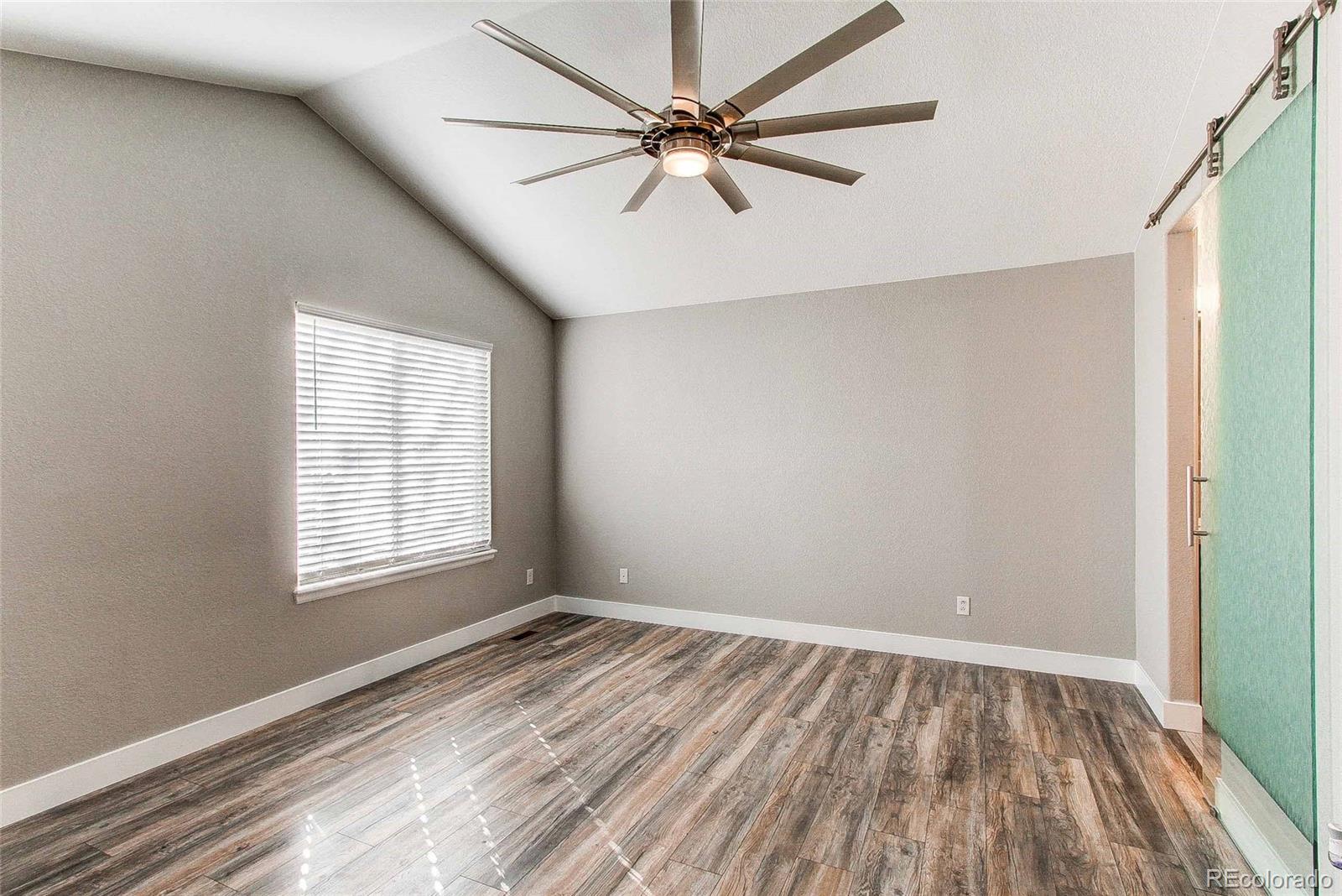 16082 Butterwort Circle Parker, CO 80134 - Photo 19 of 39 wooden floor in an empty room with a window