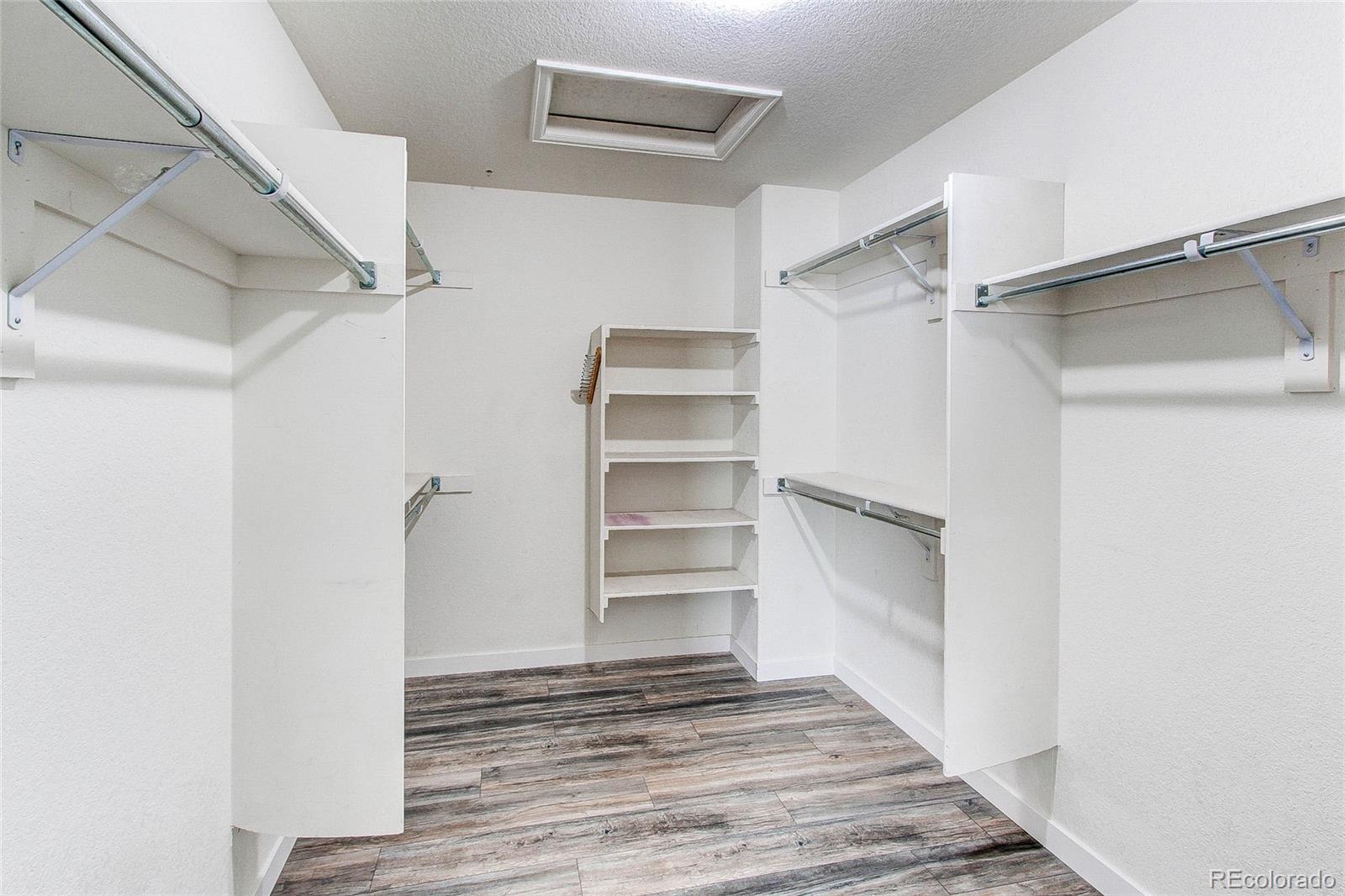 16082 Butterwort Circle Parker, CO 80134 - Photo 21 of 39 a view of walk in closet with empty racks