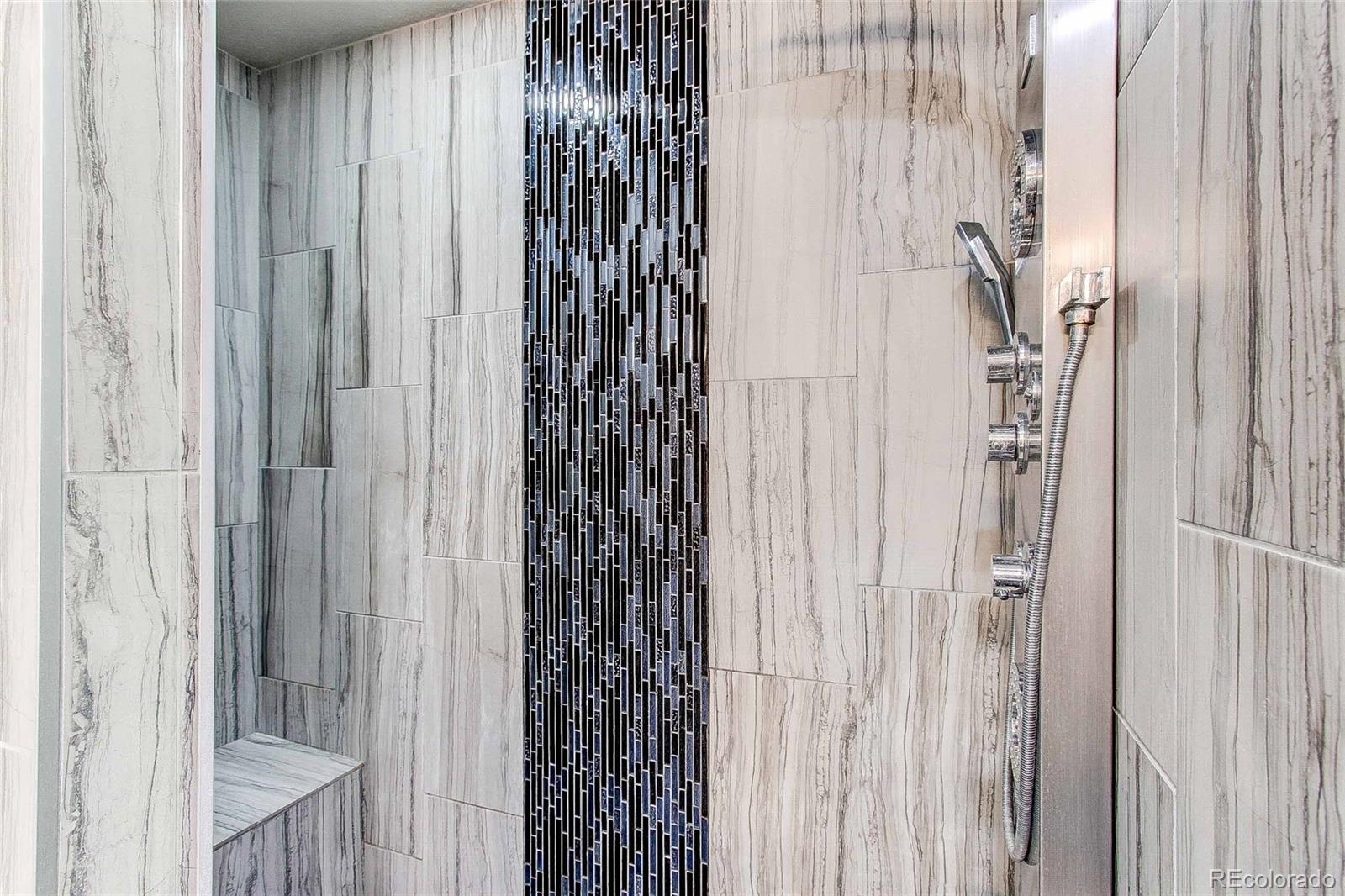 16082 Butterwort Circle Parker, CO 80134 - Photo 25 of 39 a bathroom with a shower curtain and a curtain