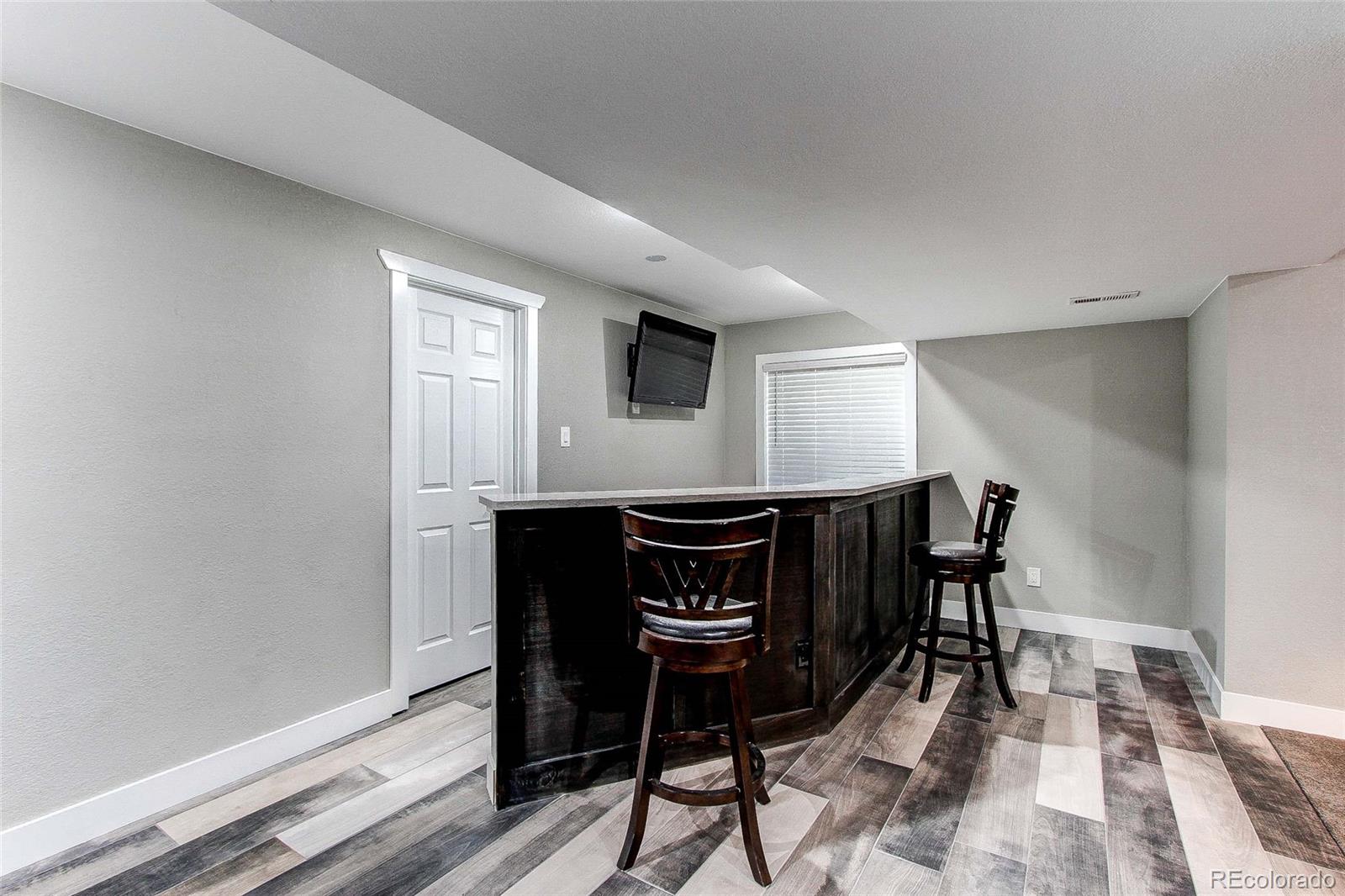 16082 Butterwort Circle Parker, CO 80134 - Photo 28 of 39 a dinning room with table and chairs