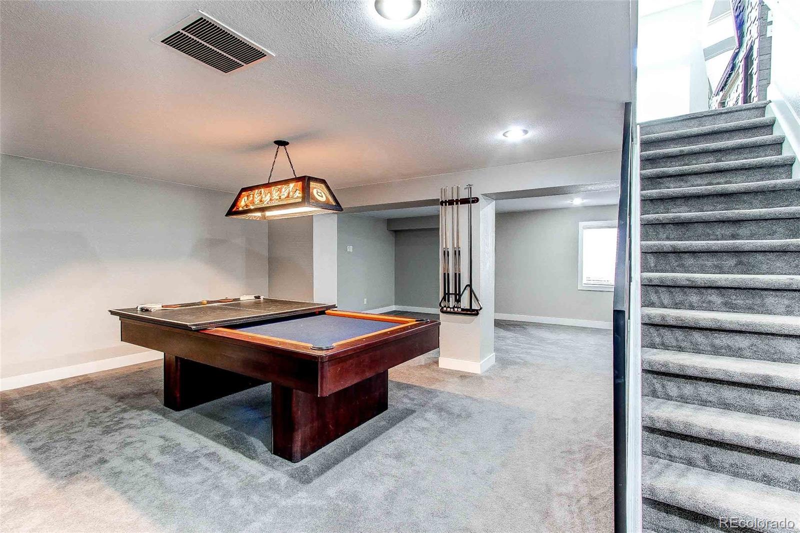 16082 Butterwort Circle Parker, CO 80134 - Photo 29 of 39 a room with pool table and window