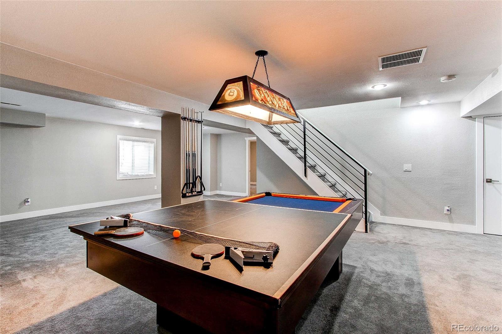 16082 Butterwort Circle Parker, CO 80134 - Photo 30 of 39 a living room with table chairs and couches