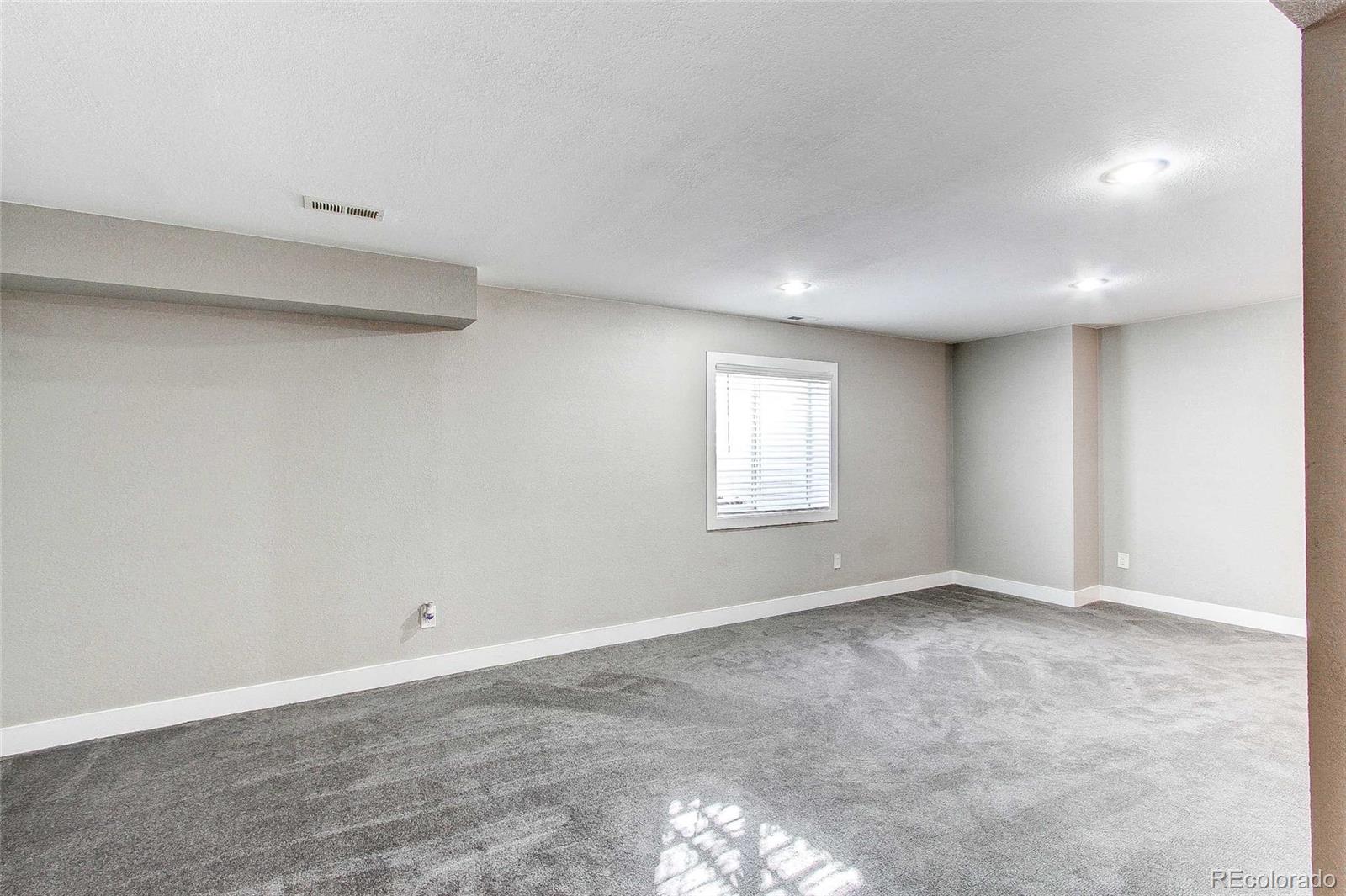 16082 Butterwort Circle Parker, CO 80134 - Photo 31 of 39 a view of an empty room with a window