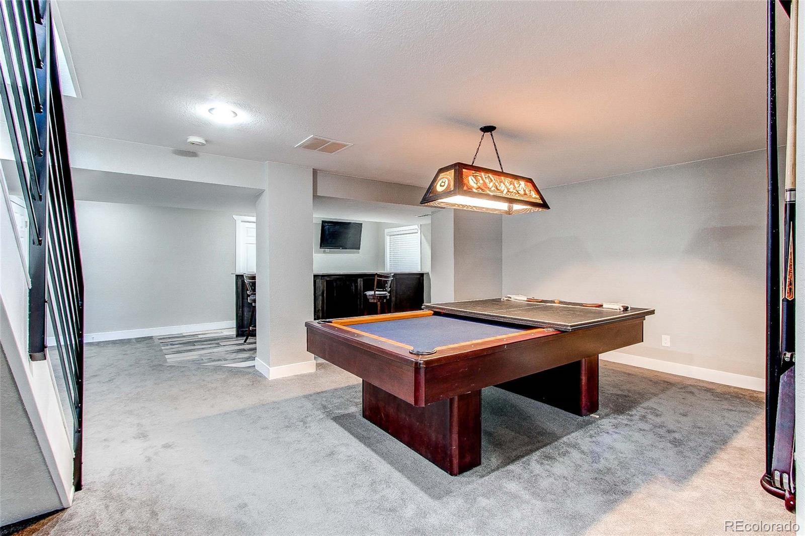 16082 Butterwort Circle Parker, CO 80134 - Photo 33 of 39 a room with pool table and flat screen tv