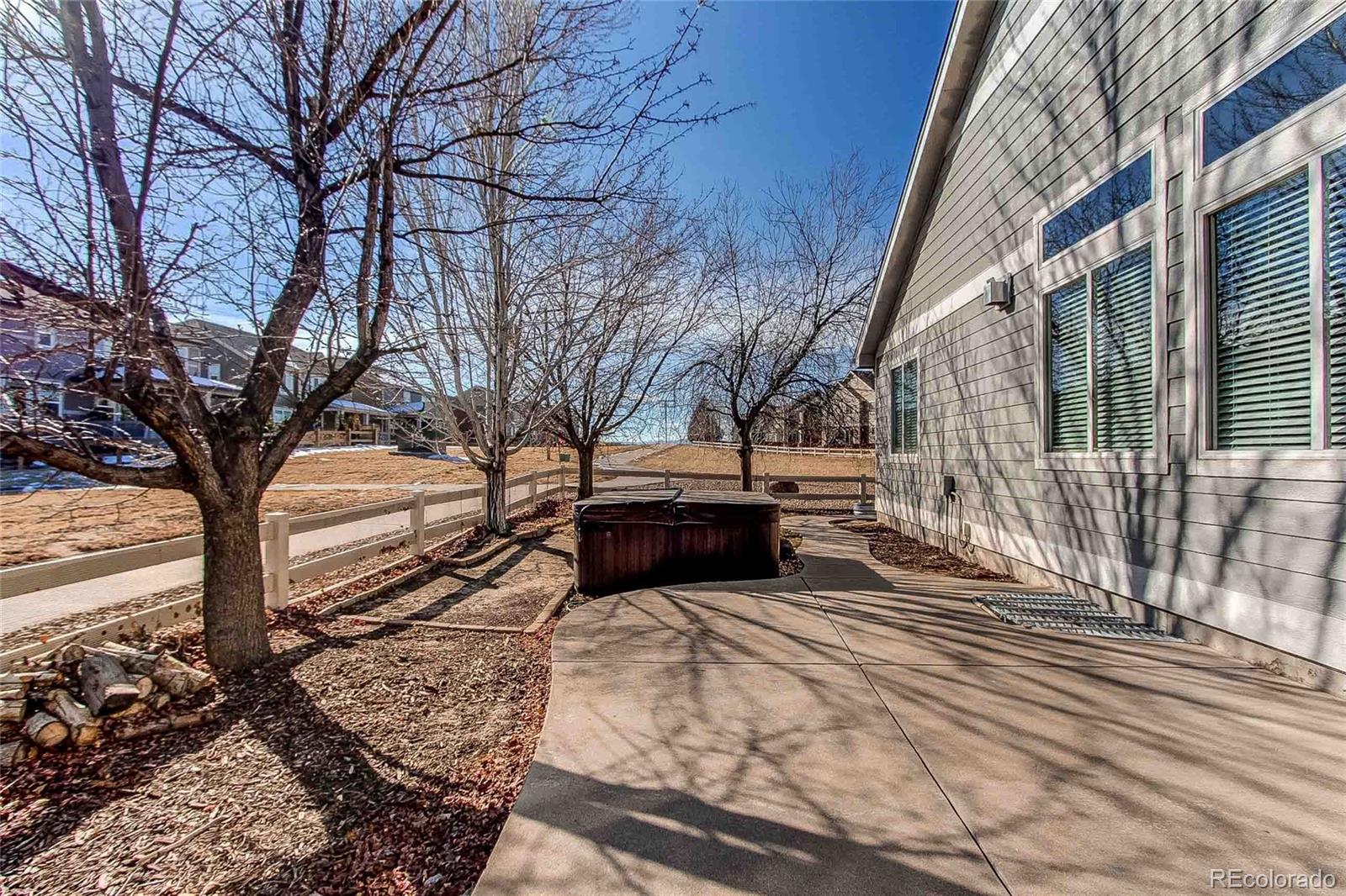 16082 Butterwort Circle Parker, CO 80134 - Photo 37 of 39 a view of a house with a yard covered in snow