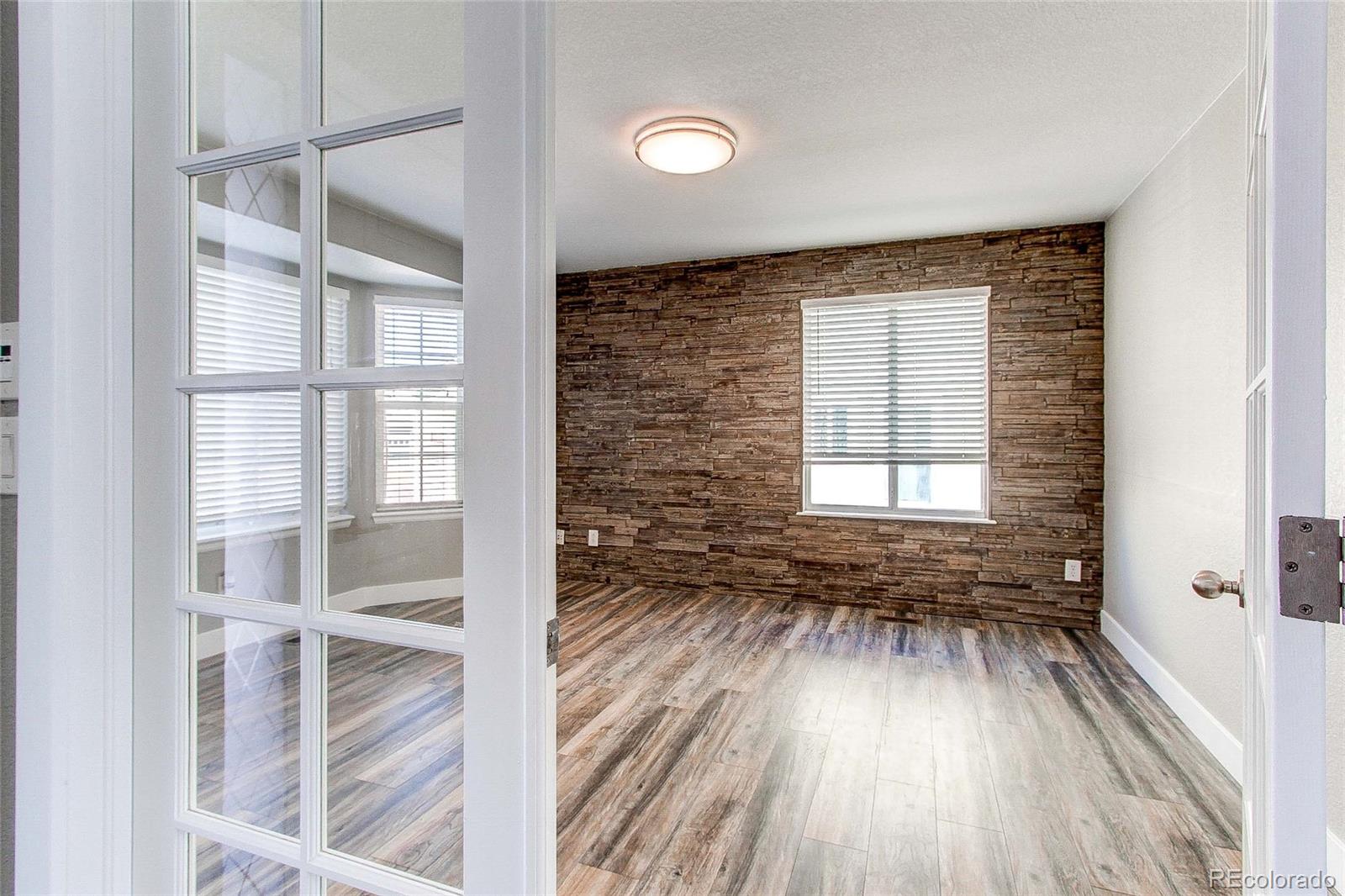 16082 Butterwort Circle Parker, CO 80134 - Photo 4 of 39 a view of a room with wooden floors and window
