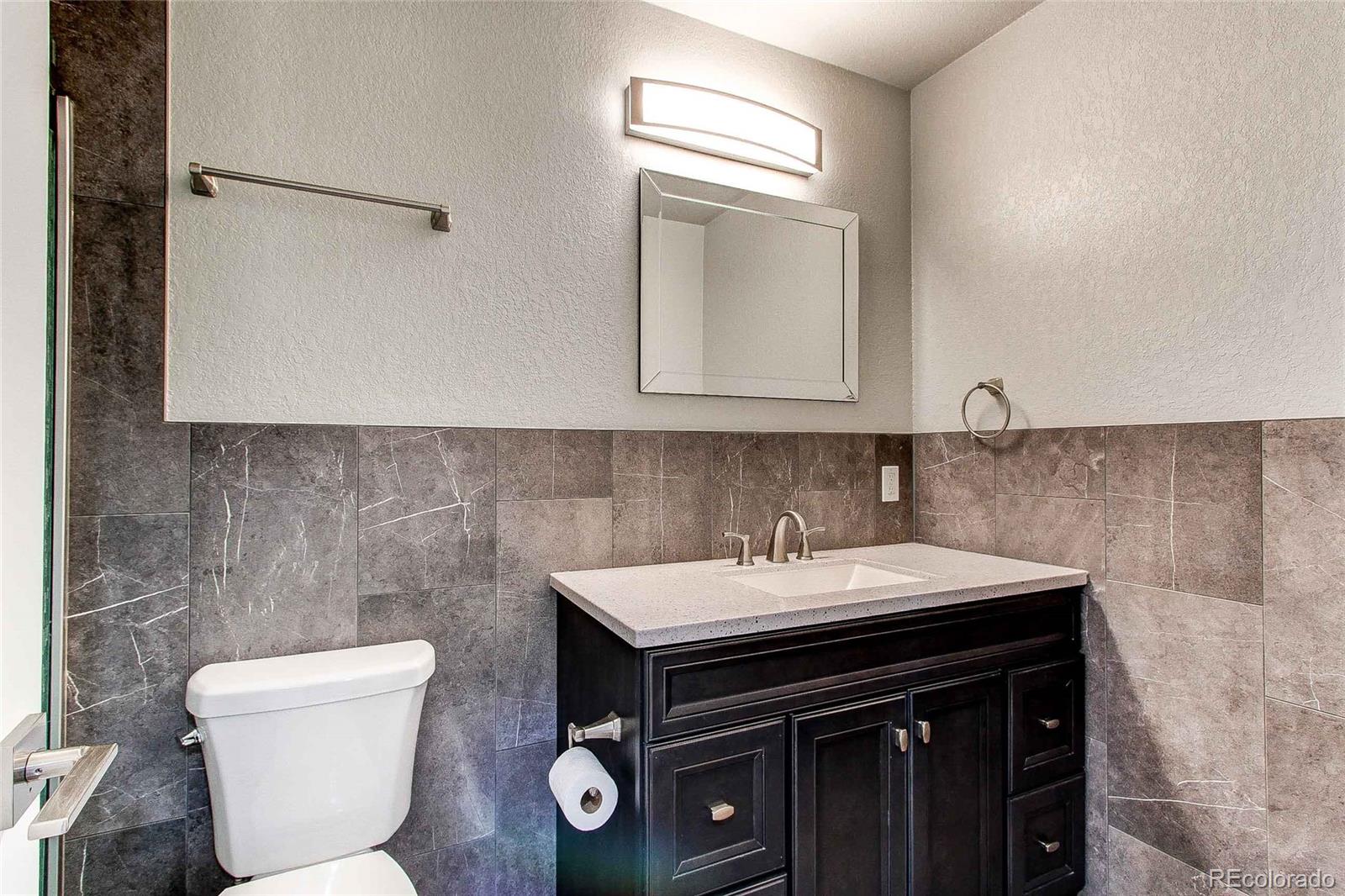 16082 Butterwort Circle Parker, CO 80134 - Photo 7 of 39 a bathroom with a sink and a toilet