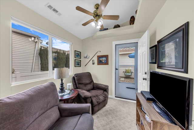2990 East Riverside Drive, Unit 166 St. George, UT 84790 - Photo 7 of 22 Living area with light carpet and ceiling fan