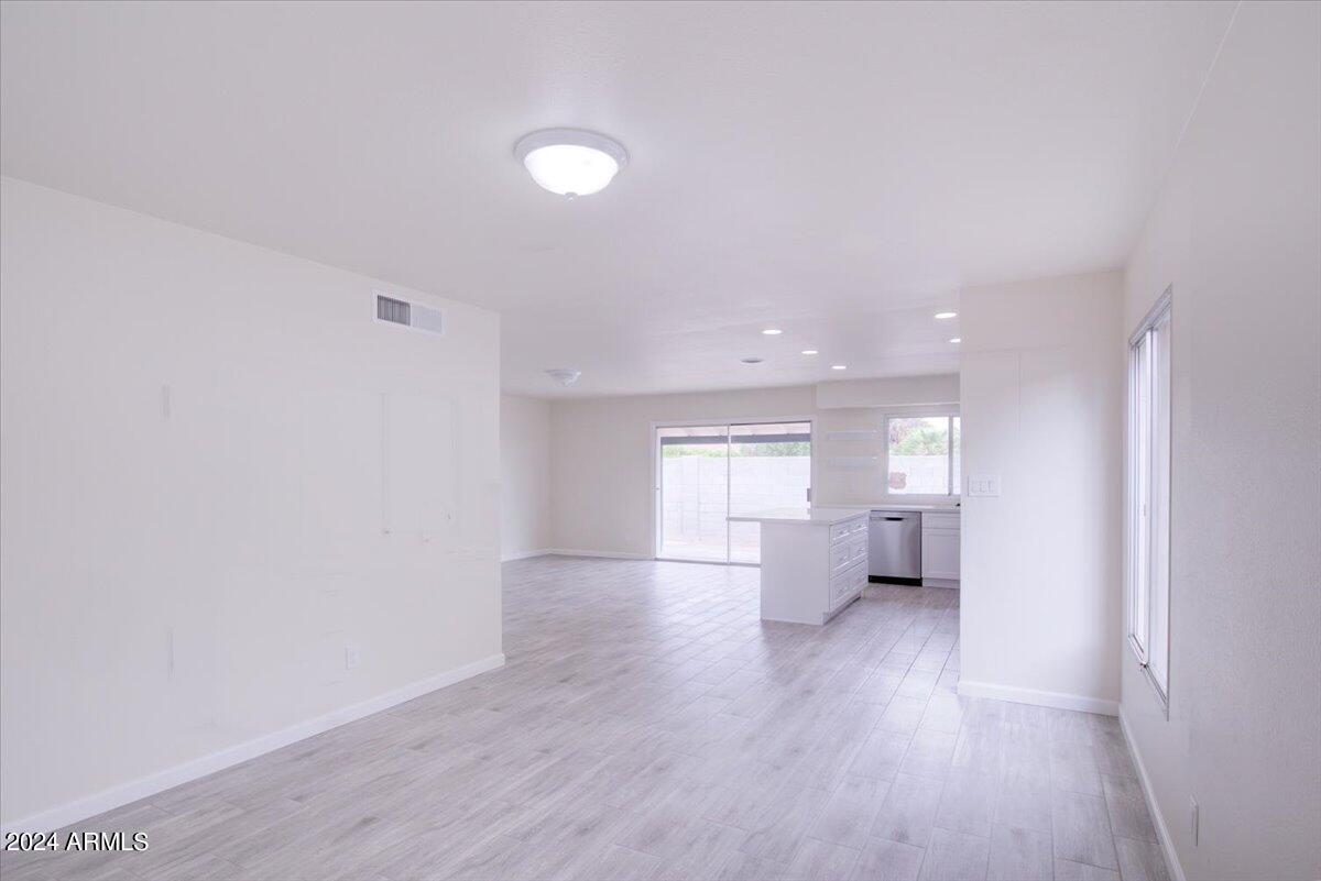 2732 East Cactus Road Phoenix, AZ 85032 - Photo 5 of 30 a view of a big room with wooden floor and windows