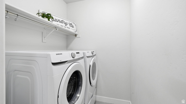111 East Silver Oak Road Vineyard, UT 84059 - Photo 16 of 50 Dedicated laundry area featuring a white wall shelf with an integrated hanging rod and white walls