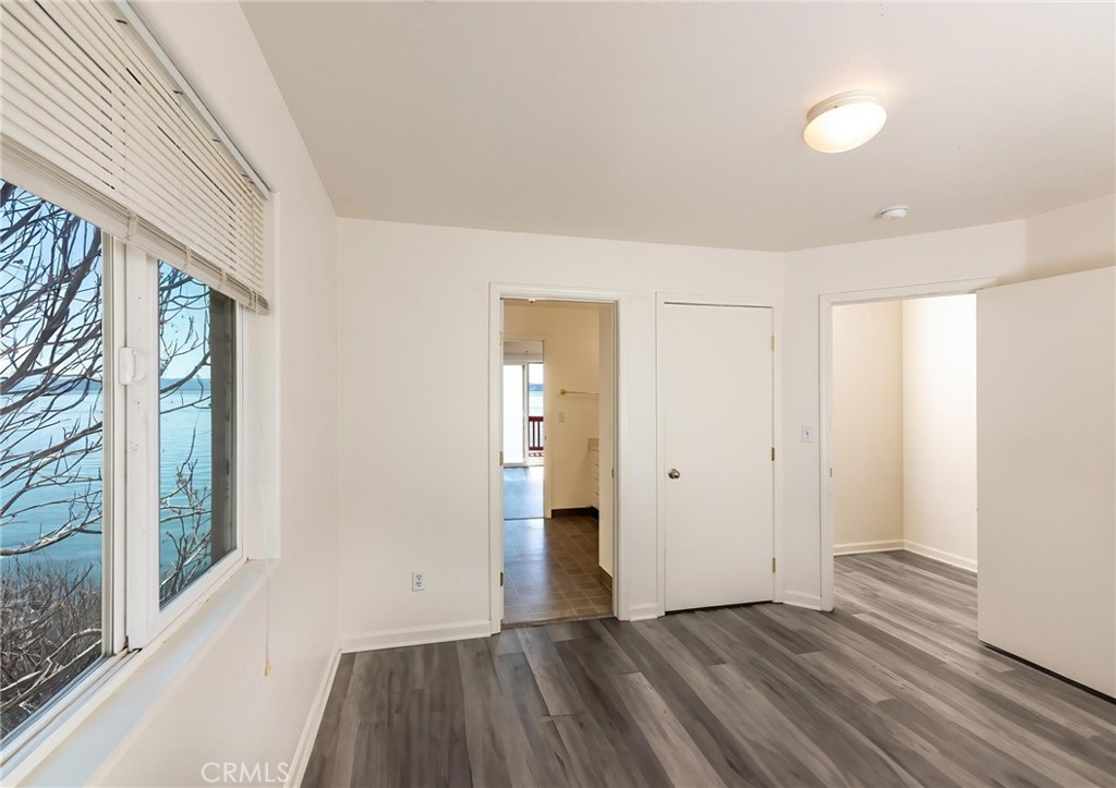4571 State Highway 20 Nice, CA 95464 - Photo 13 of 24 a view of an empty room with wooden floor and a window
