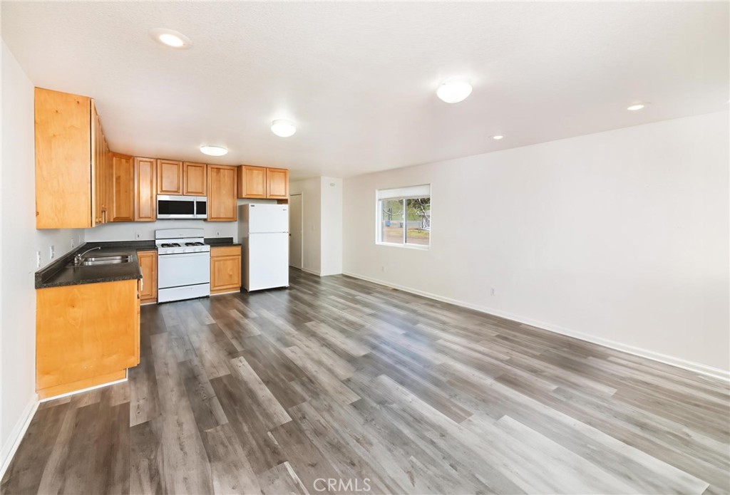 4571 State Highway 20 Nice, CA 95464 - Photo 6 of 24 a view of a kitchen with a sink a refrigerator and window