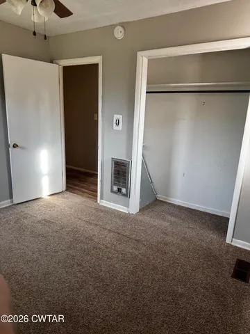 a view of empty room with a fireplace