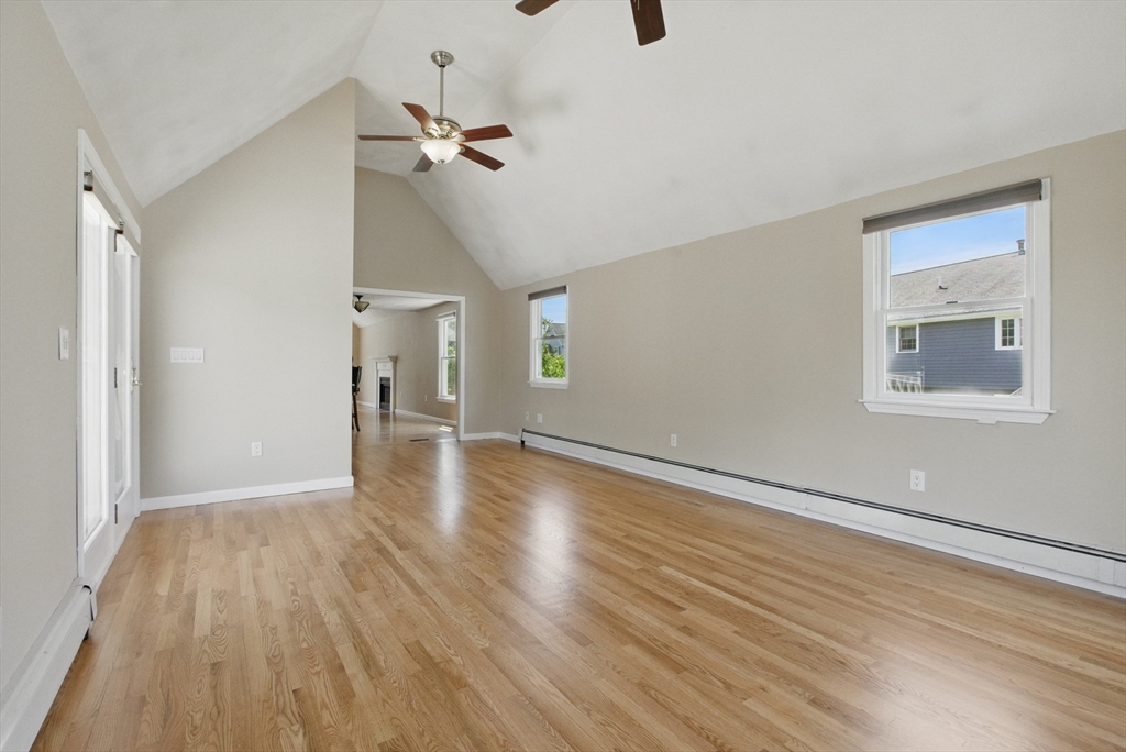 25 Sandra Road Peabody, MA 01960 - Photo 12 of 41 a view of a room with wooden floor ceiling fan and window