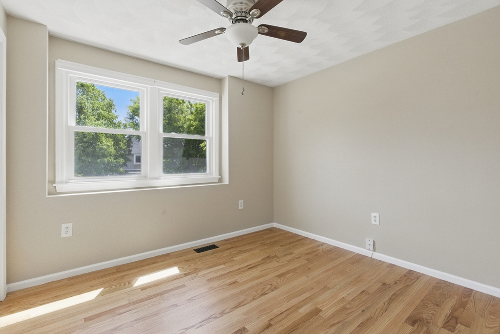 25 Sandra Road Peabody, MA 01960 - Photo 27 of 41 a view of empty room with wooden floor and fan