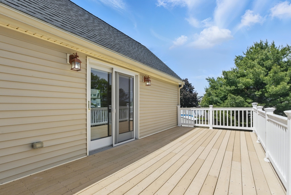 25 Sandra Road Peabody, MA 01960 - Photo 35 of 41 a view of deck with wooden floor and fence