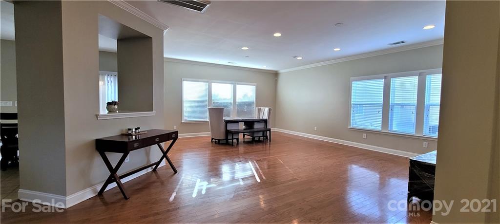 9611 Seamill Road Charlotte, NC 28278 - Photo 2 of 26 a living room with furniture and a dining table with kitchen view