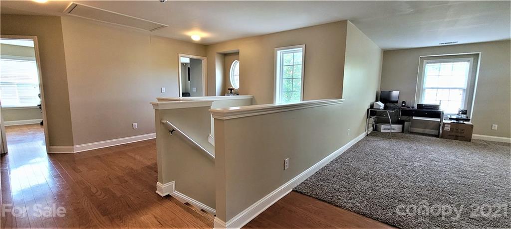 9611 Seamill Road Charlotte, NC 28278 - Photo 12 of 26 a view of a livingroom with furniture window and wooden floor