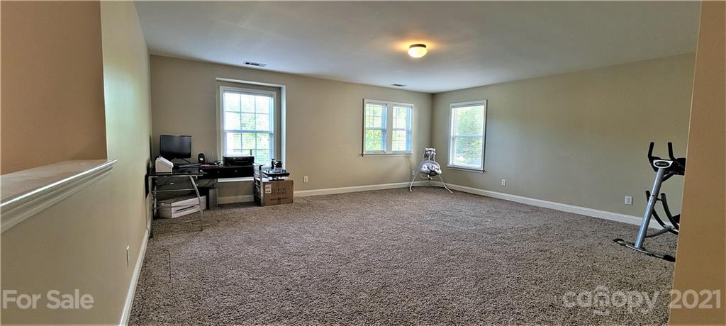 9611 Seamill Road Charlotte, NC 28278 - Photo 14 of 26 a living room with furniture and a window