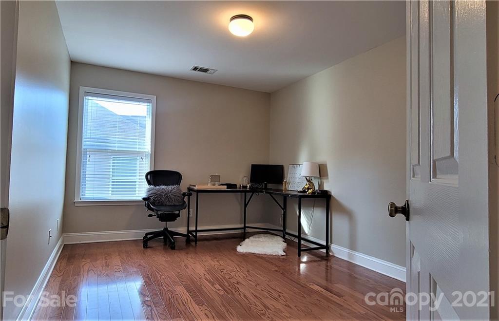 9611 Seamill Road Charlotte, NC 28278 - Photo 15 of 26 a view of a workspace with furniture and a window