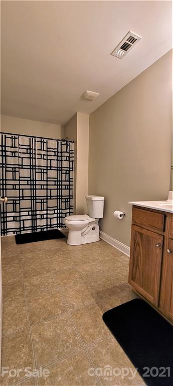 9611 Seamill Road Charlotte, NC 28278 - Photo 18 of 26 a view of a bedroom with furniture and staircase