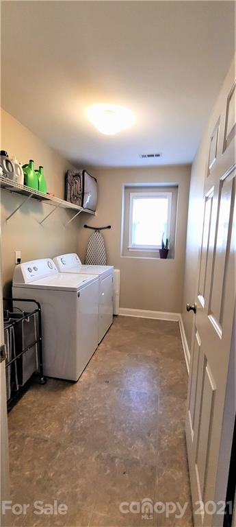 9611 Seamill Road Charlotte, NC 28278 - Photo 19 of 26 a room with a stove top oven and sink