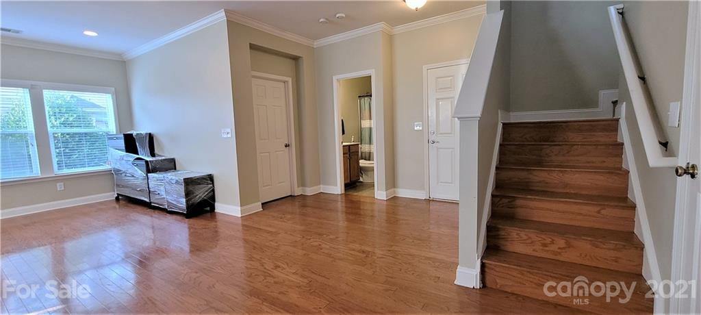9611 Seamill Road Charlotte, NC 28278 - Photo 3 of 26 a view of a livingroom with furniture and staircase