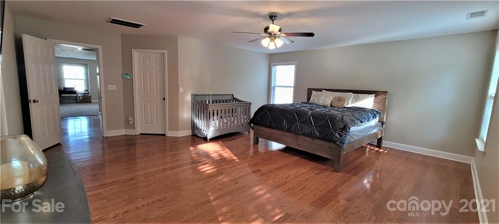 9611 Seamill Road Charlotte, NC 28278 - Photo 21 of 26 a bedroom with bed and window