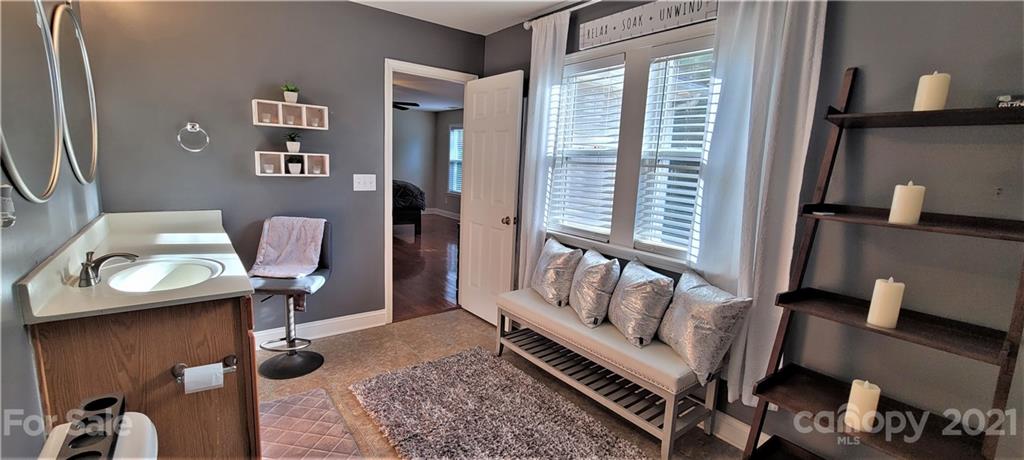9611 Seamill Road Charlotte, NC 28278 - Photo 23 of 26 a bedroom with furniture and a window