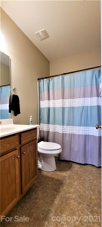 9611 Seamill Road Charlotte, NC 28278 - Photo 10 of 26 a bathroom with a sink and a toilet