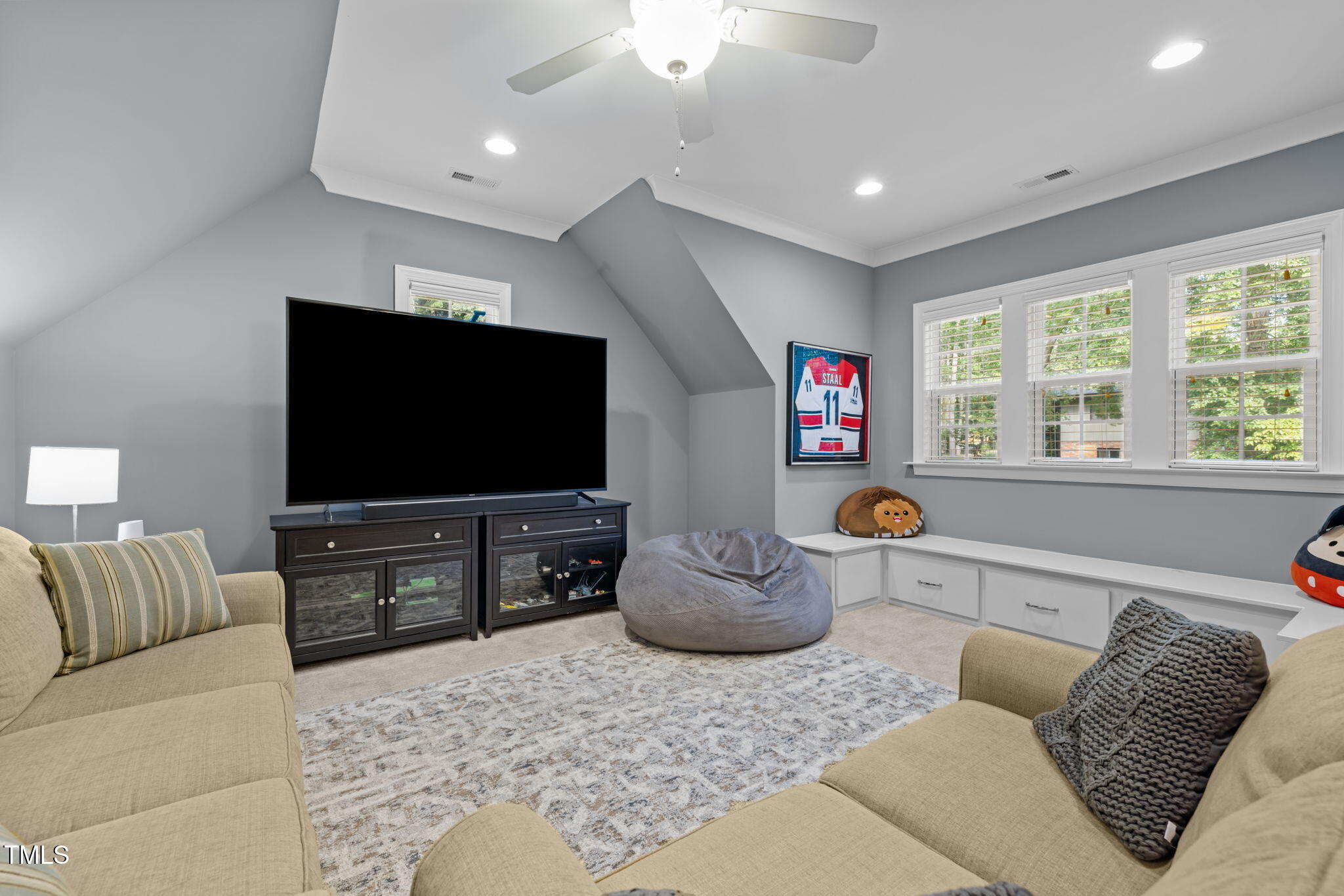 3005 Club Drive Raleigh, NC 27613 - Photo 32 of 45 a living room with furniture and a flat screen tv