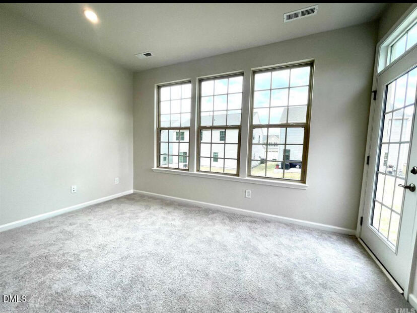224 Hopewell Lane Wake Forest, NC 27587 - Photo 7 of 17 a view of an empty room with a window