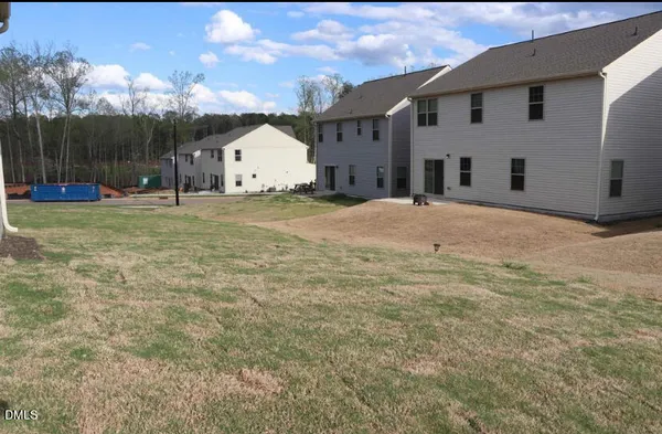 a view of a backyard of the house