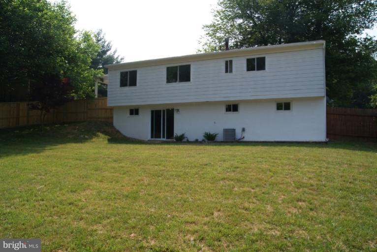 2302 Kingsway Road Fort Washington, MD 20744 - Photo 7 of 30 a front view of a house with a garden