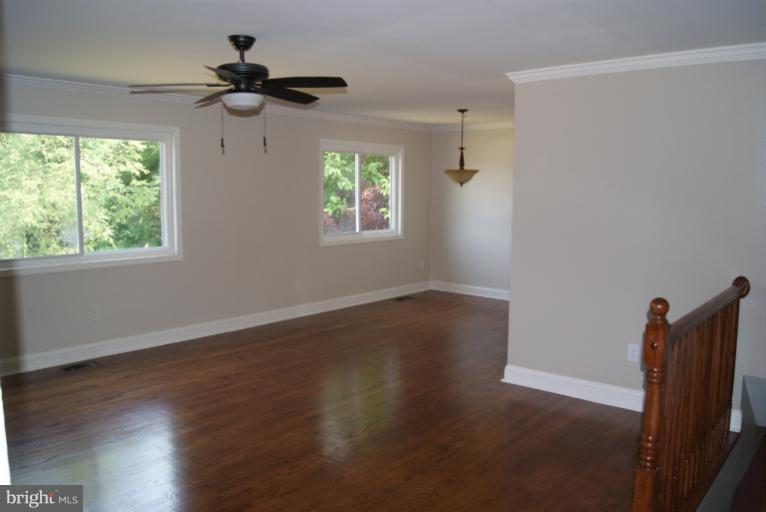 2302 Kingsway Road Fort Washington, MD 20744 - Photo 8 of 30 a view of an empty room with wooden floor and a window
