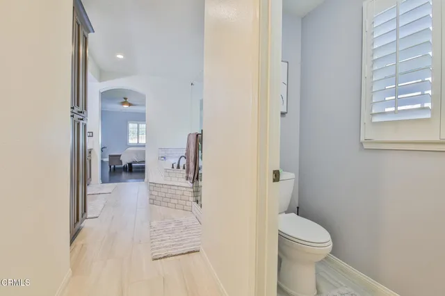 a bathroom with a sink toilet and a vanity