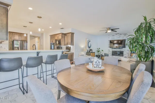a dining room with furniture and window