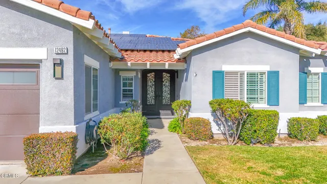 a front view of house with outdoor seating