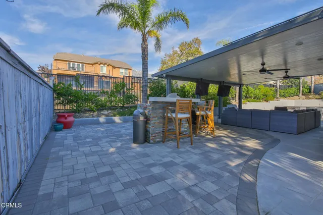 a backyard of a house with seating space
