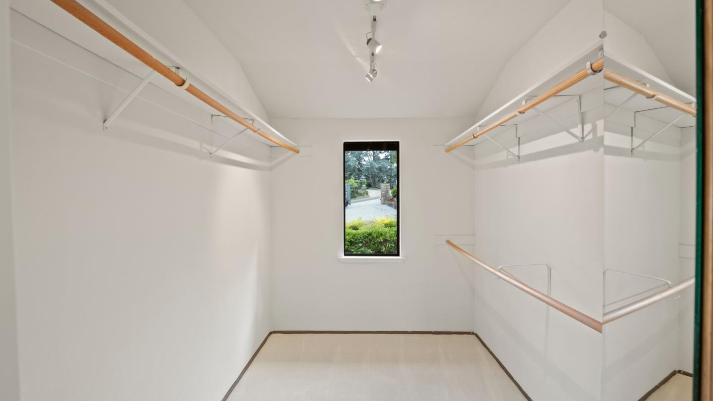 16353 Aztec Ridge Drive Los Gatos, CA 95030 - Photo 25 of 61 a view of a hallway with white walls and a window