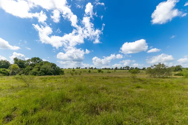 a view of a lake with a big yard